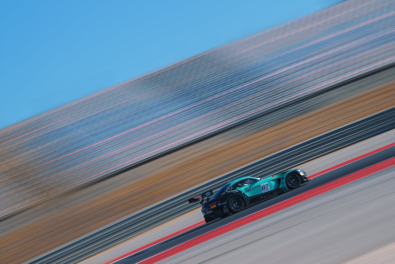 GT3 car flat out on the straight