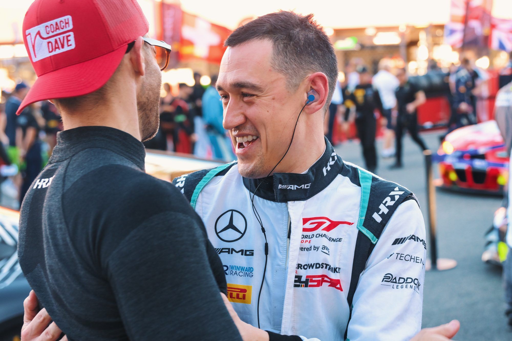 Racing driver with his coach on the grid