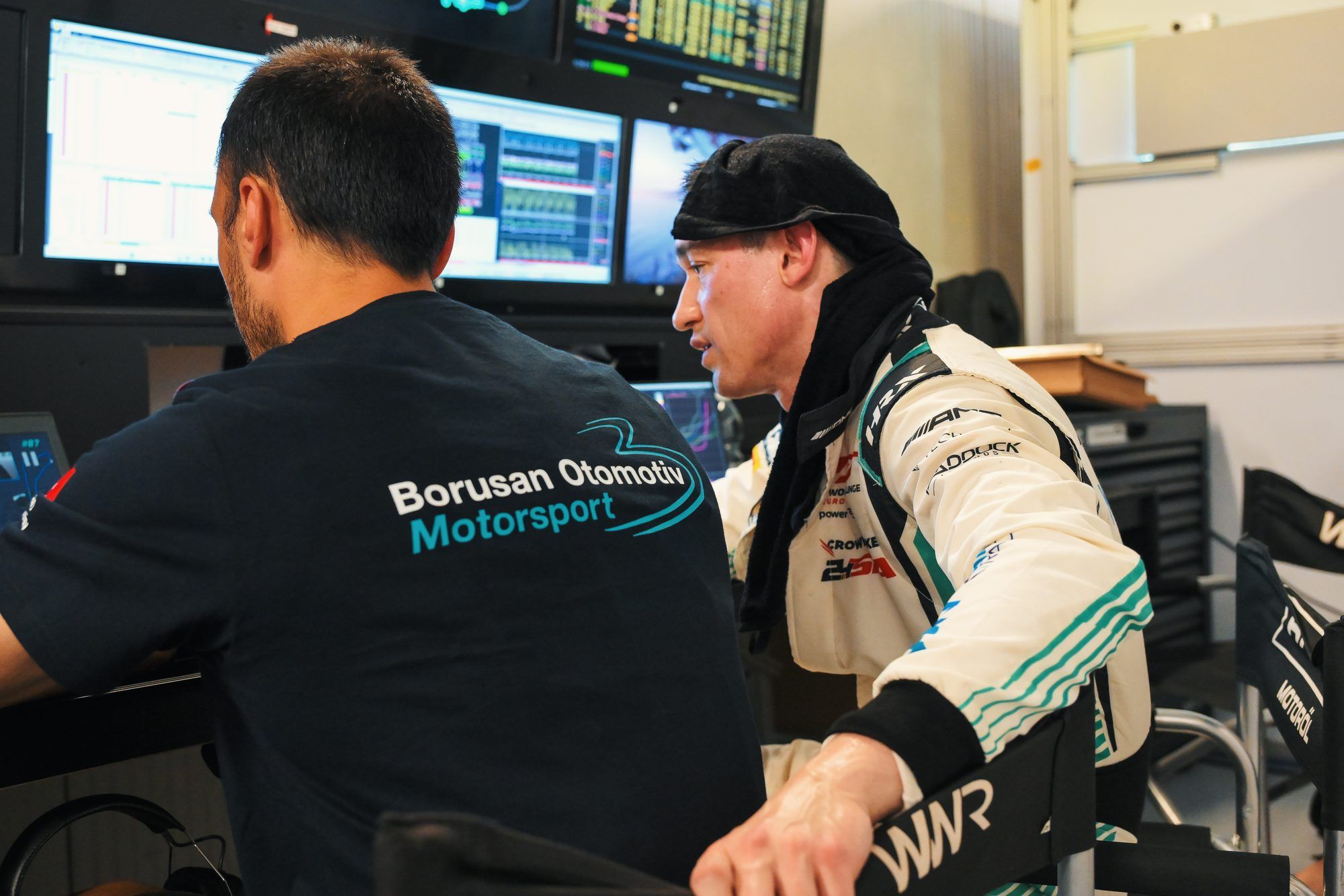 Engineer at the data screens with the driver