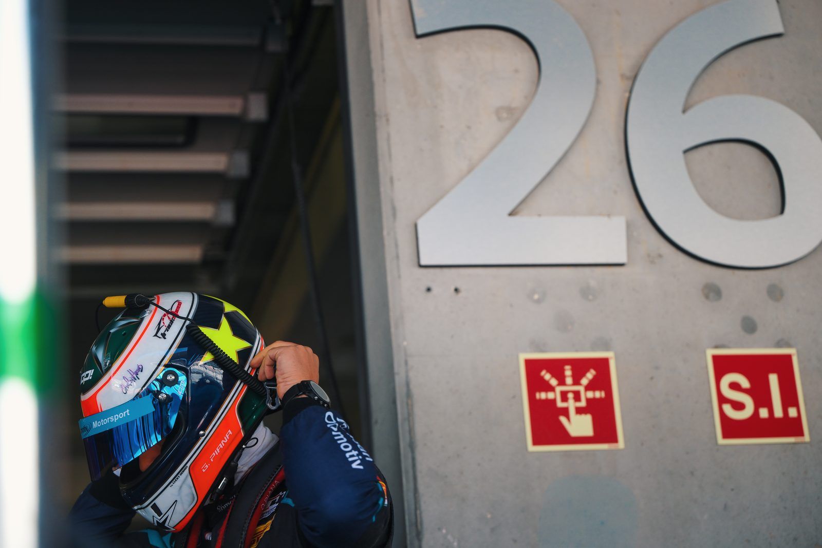 Driver getting ready by garage 26
